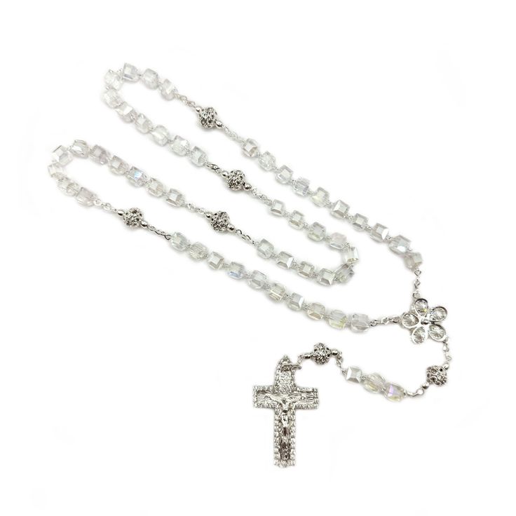 Clear glass cubes rosary, with silver-plated accents and an ornate crucifix,  perfect for weddings, first communions, baptisms, and other special occasions. Elegant Silver Rosary As Gift, Elegant Silver Rosary For First Communion, Silver Cross Rosary For Wedding, Silver Cross Rosary As Gift, Adjustable Silver Crucifix Rosary, Silver Jewelry With 8mm Beads For First Communion, Elegant Cross Rosary For First Communion, Silver Crucifix For Wedding, Silver Baptism Jewelry With 8mm Beads