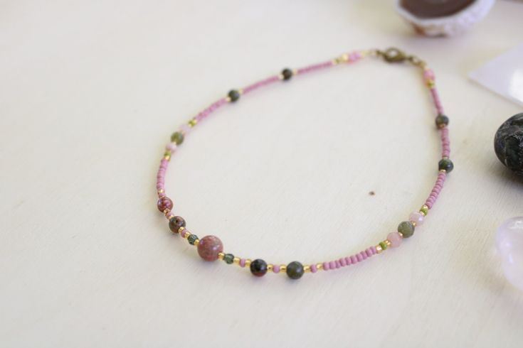 Various Unakite gemstones, pink and green jade, glass crystal beads, with pink and gold glass seed beads. Gold filled claps closure. 12 INCHES Pink Natural Stones Beads As Gift, Pink Bohemian Beaded Bracelets In Czech Glass, Bohemian Pink Beaded Bracelets Czech Glass, Bohemian Pink Beaded Bracelets From Czech Glass, Pink Beaded Czech Glass Necklace, Bohemian Pink Czech Glass Beaded Necklaces, Pink Spiritual Jewelry With Tiny Beads, Pink Czech Glass Beaded Bracelets With Colorful Beads, Pink Czech Glass Beaded Bracelet With Colorful Beads