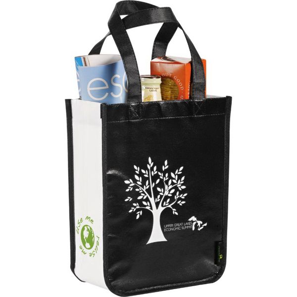 a black and white shopping bag with a tree on the front is holding various items