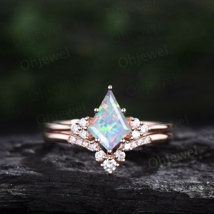 "This is a lab opal engagement ring in solid gold,about 6x9mm kite cut. The accent stones are  round diamond or moissanites. The matching band stones are diamond or moissanites. The band width is about 1.3mm. It can be made in any ring size. However please contact me to custom make it to a special big or small size. It can be made in white gold,rose gold or yellow gold with 14k or 18k. However for some people who are nickel allergic,I can also make it to 925 sterling silver to make you can wear it. The ring is handmade,very high quality! 30 days money back guarantee. Returns & Warranty 30-Day money back guarantee (starting from the day of delivery). \"Made to Order\" purchases qualify for our 30-day money back guarantee. The 30-day money back guarantee gives you time to make sure your purc Dainty Diamond-shaped Jewelry For Wedding, Minimalist Diamond-shaped Jewelry For Wedding, Opal Solitaire Promise Ring, Marquise Opal Jewelry As A Gift, Marquise Opal Jewelry For Gift, Marquise Opal Jewelry Gift, Opal Marquise Jewelry For Gifts, Opal Jewelry With Prong Setting For Promise Ring, 14k Gold Diamond-shaped Promise Ring