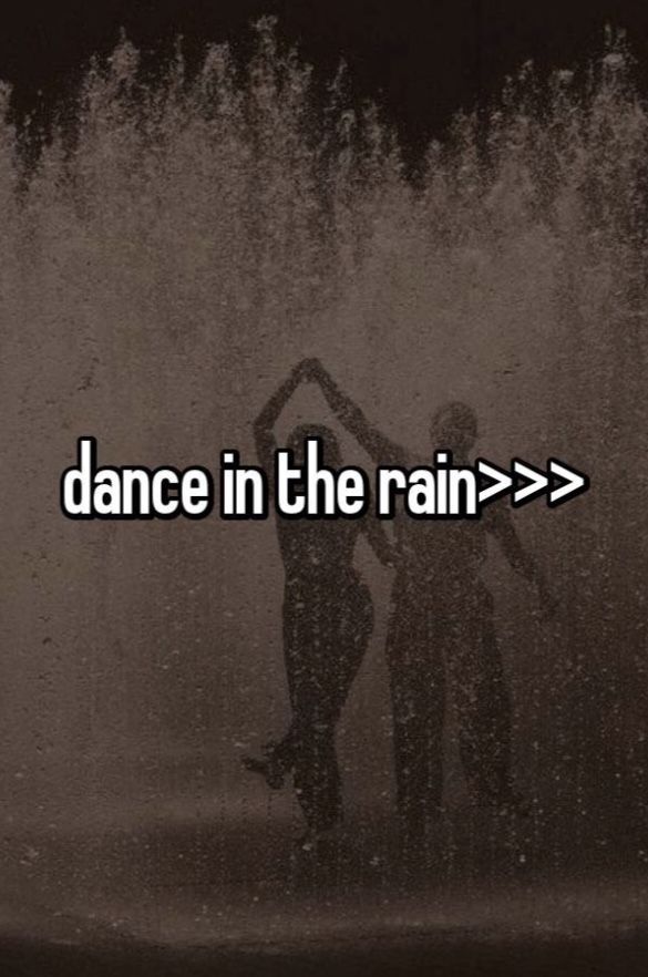 two people standing in front of a fountain with the words dance in the rain