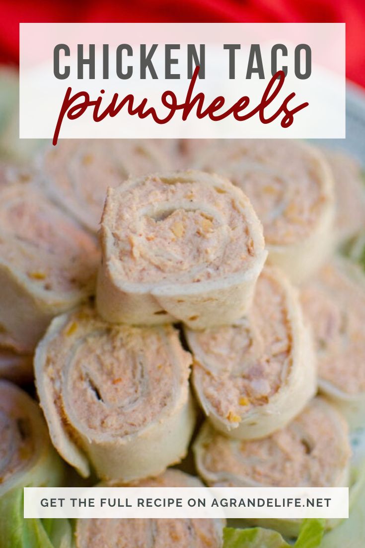 chicken taco pinwheels on a plate with lettuce in the background