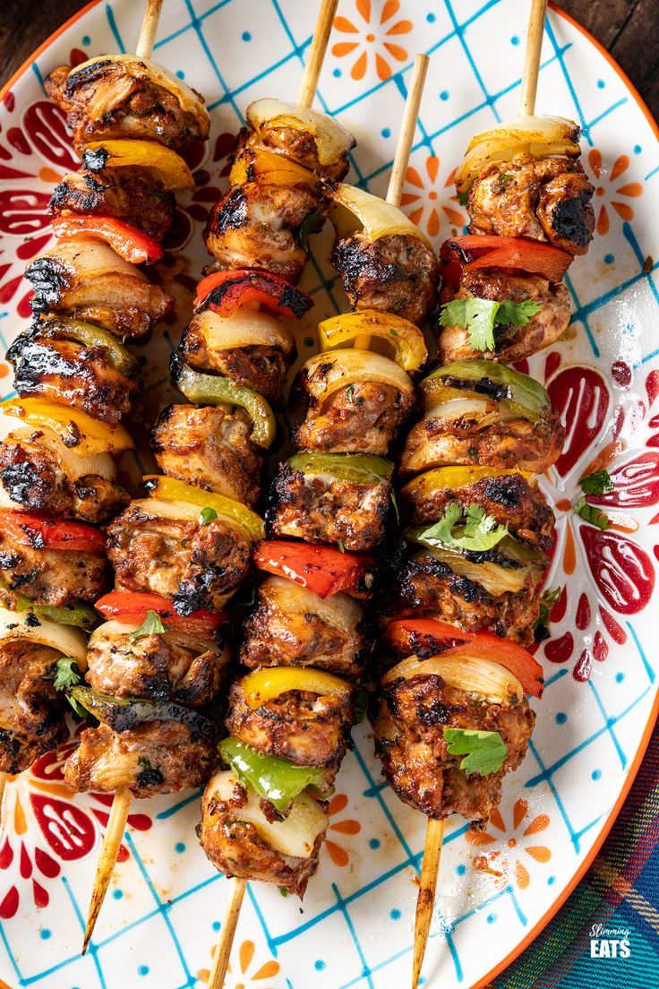 grilled meat and vegetable kabobs on a plate