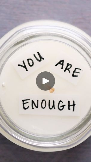 an empty jar with the words you are enough written on it