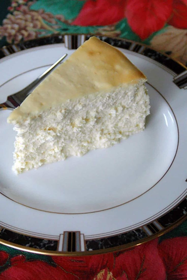 a piece of cake sitting on top of a white plate with gold trim around it