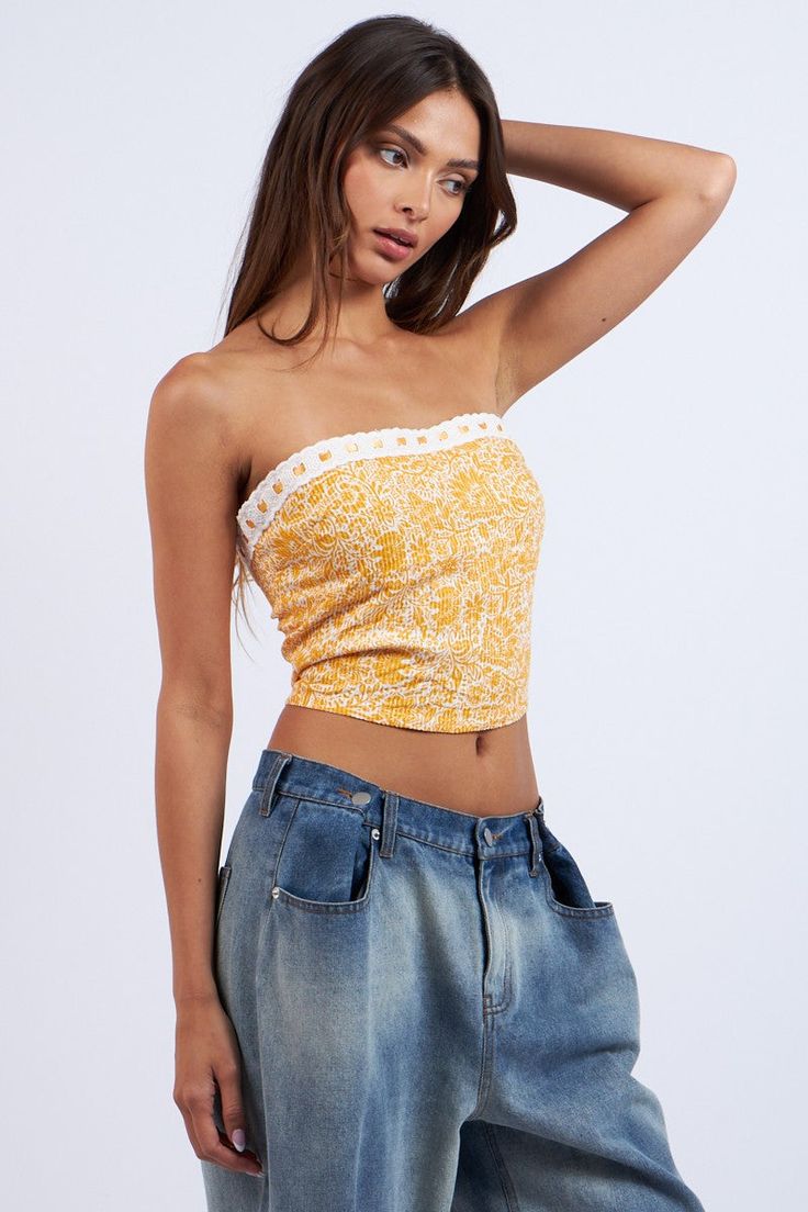 The Cora Orange Floral Print Tube Top is a summer essential! Orange floral print fabric shapes this strapless tube top with a cropped bodice. Features a ribbon trim detail and an exposed back zipper/closure. Style with a denim skirt for a cute summer look! DETAILS & FIT Fitted. S: 11" Length, 28" Bust M: 11.5" Length, 30' Bust L: 12" length, 32" Bust 100% Rayon. Lining: Polyester. For best results dry clean. Imported. ORDERS, SHIPPING & RETURNS: Orders, Shipping, & Returns Strapless Floral Print Tube Top For Day Out, Stretch Strapless Crop Top For Summer, Fitted Strapless Tube Top For Spring, Spring Bandeau Stretch Crop Top, Spring Bandeau Halter Top For Summer, Strapless Floral Print Tube Top, Fitted Floral Print Strapless Tube Top, Summer Off-shoulder Fitted Tube Top, Off-shoulder Crop Top For Beach In Spring