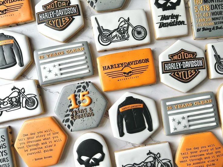 decorated cookies are arranged in the shape of motorcyclists and motorcycle related items