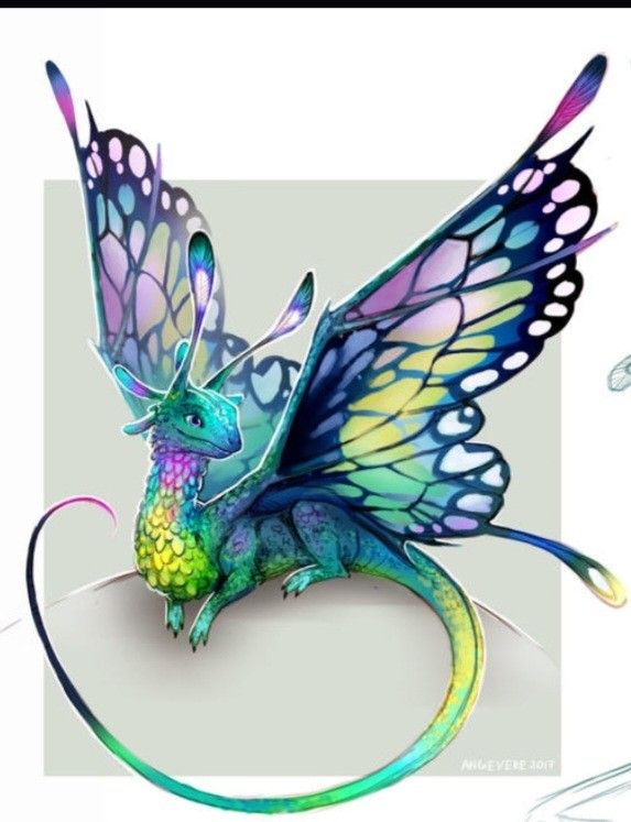 a blue and green dragon sitting on top of a circular object with wings spread out