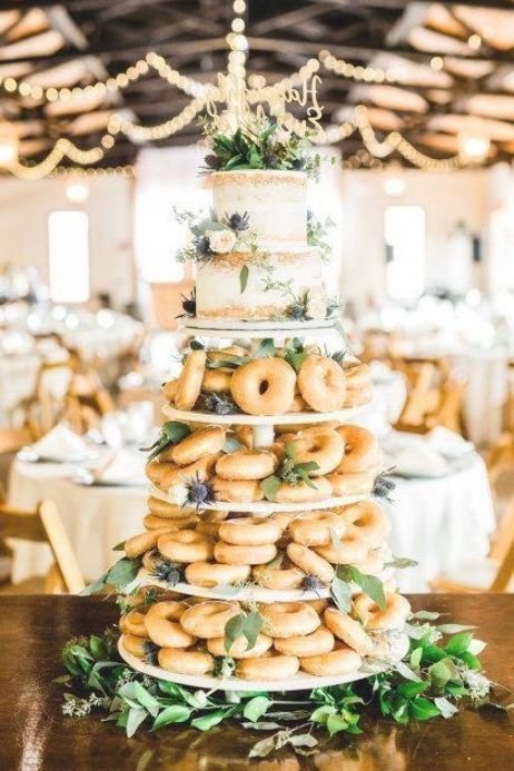 a wedding cake made out of donuts on top of a table