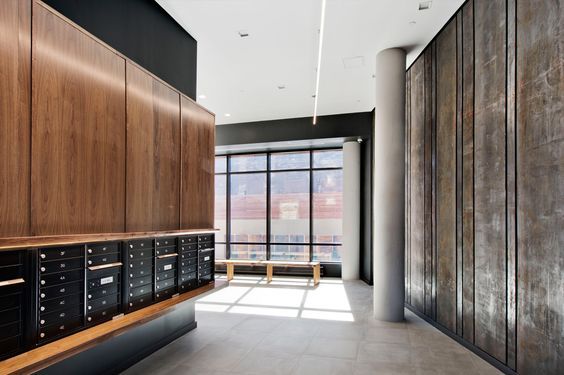 an empty room with many mail boxes on the wall