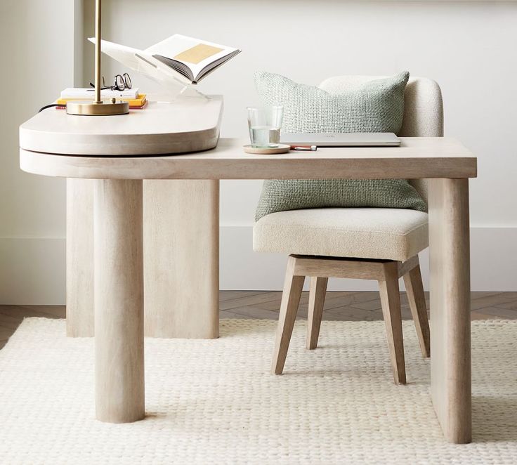 a table with a chair and a book on it