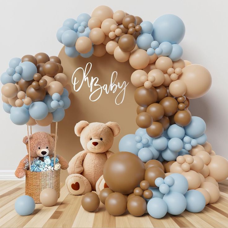 there is a teddy bear and balloons in front of the baby's name sign