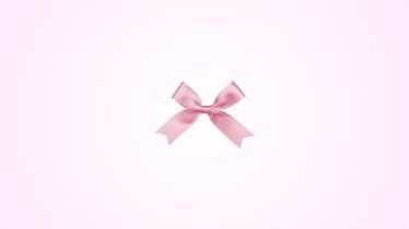 a pink wall with a bow on it