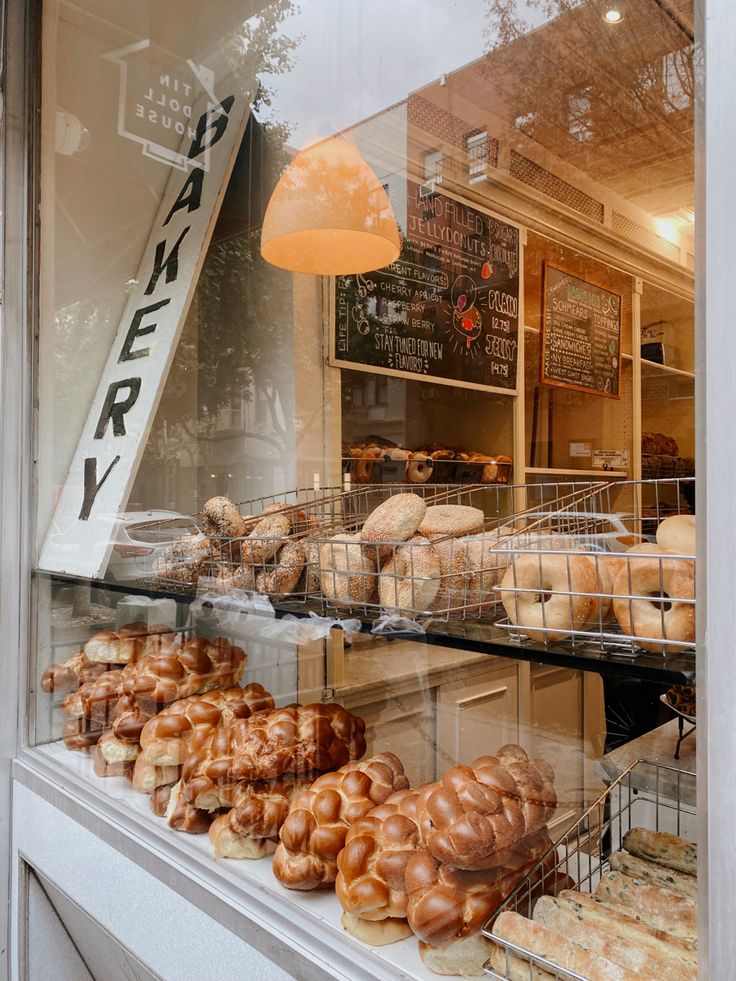 a bakery window filled with lots of pastries