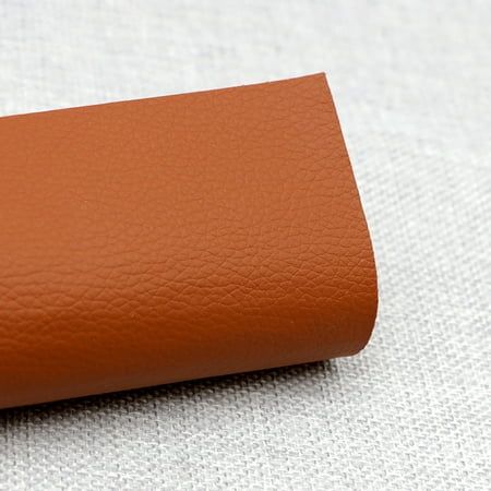 a brown leather case sitting on top of a white surface