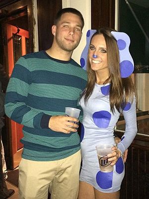 a man and woman dressed up in costumes