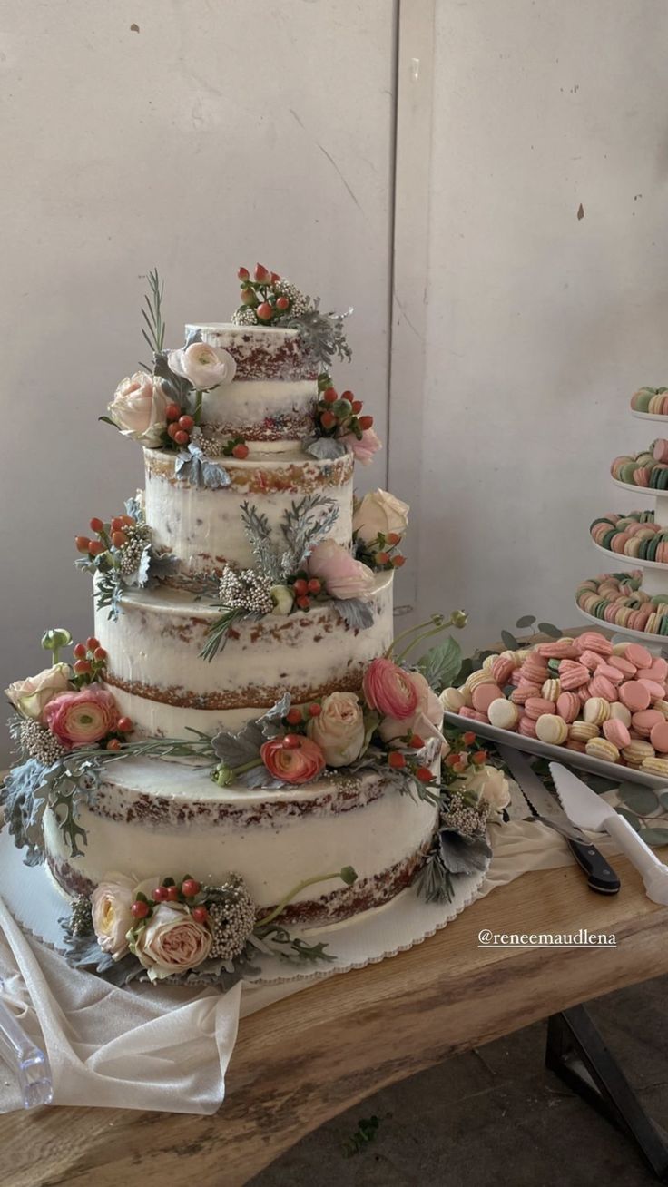 a large wedding cake sitting on top of a wooden table