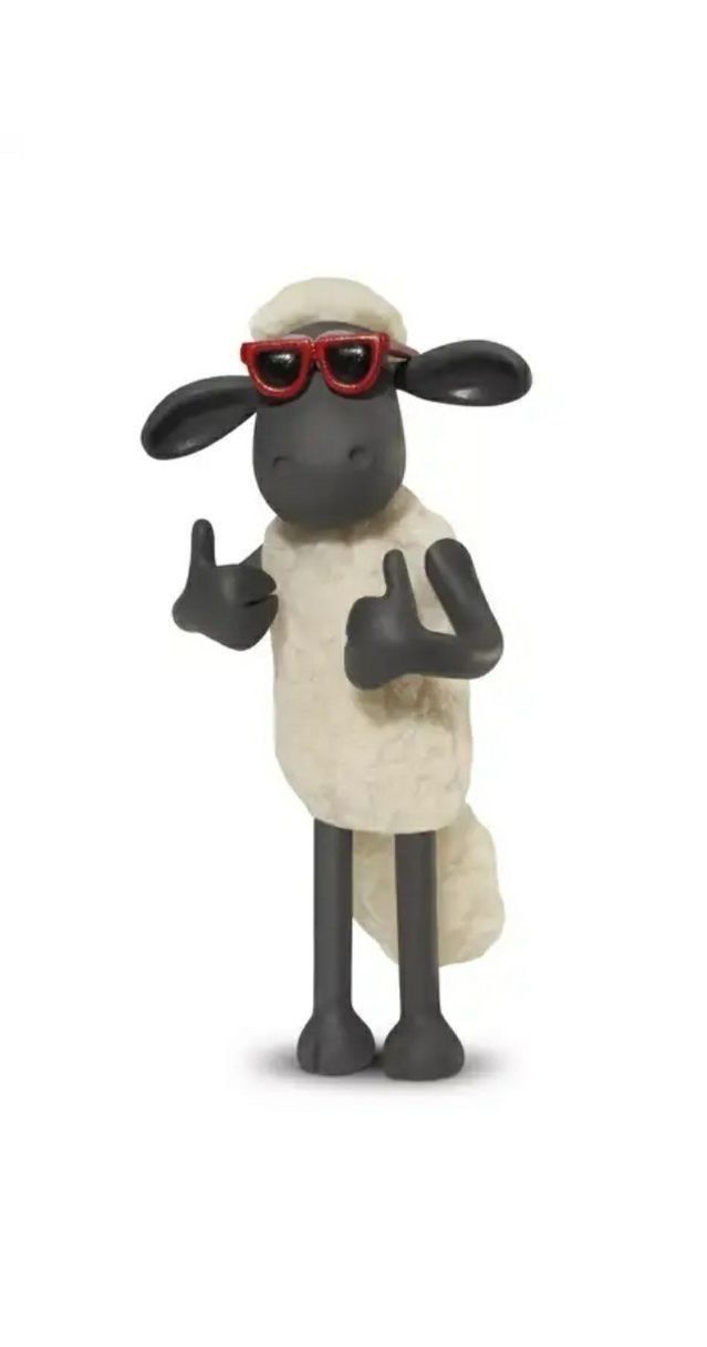 a black and white sheep with sunglasses giving the thumbs up