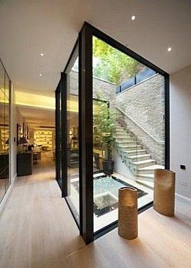 the inside of a house with glass walls