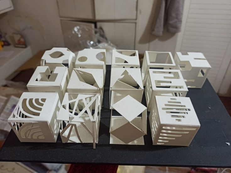 several pieces of architecture sitting on top of a table