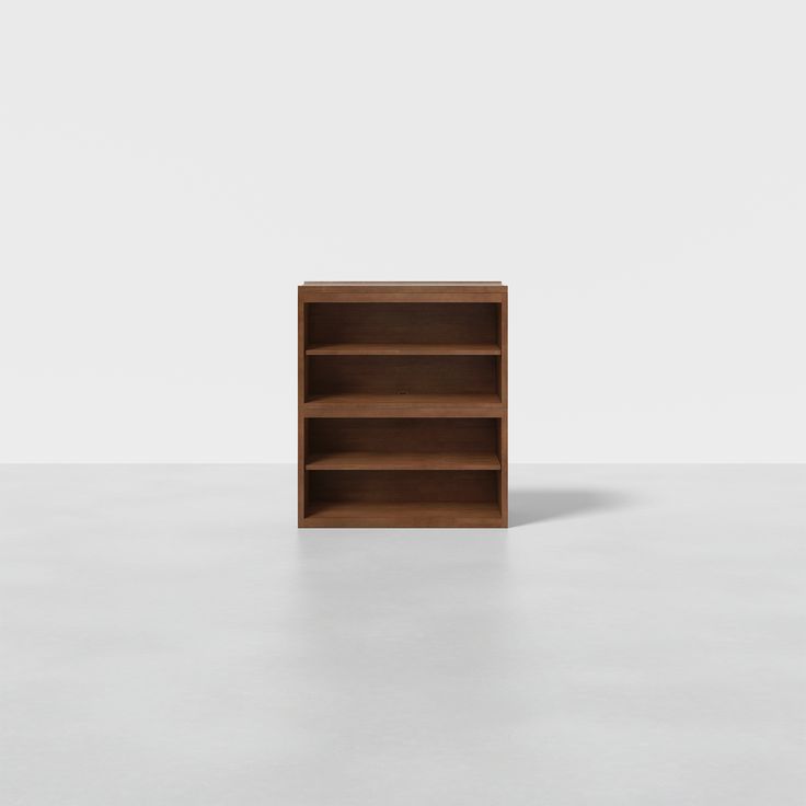 an empty bookcase on a white surface with no one in it or someone else