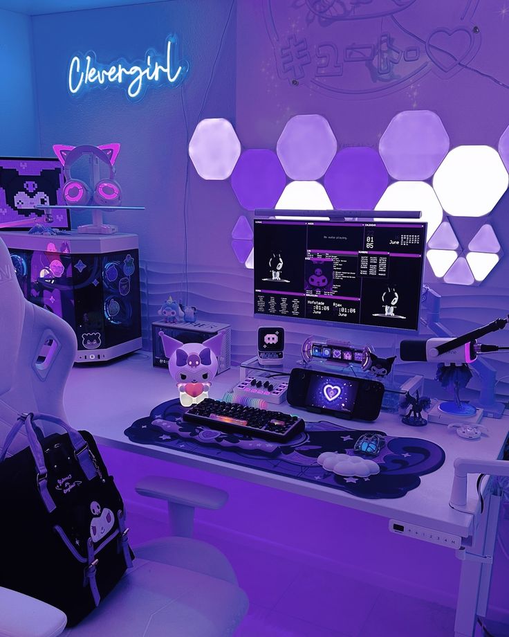 a room with purple lighting and various items on the desk, including a computer monitor