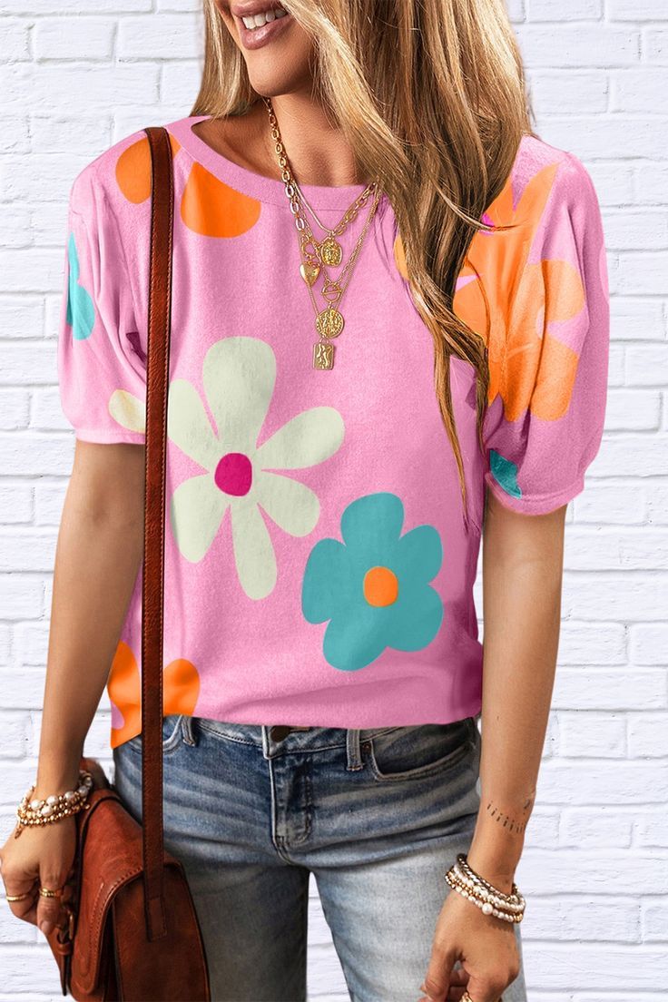 Introducing our Flower Round Neck Short Sleeve Blouse, a delightful blend of fun and brightness to elevate your wardrobe! Crafted with care, this blouse is designed to bring a pop of color and joy to any occasion. Cute Multicolor T-shirt For Spring, Colorful Short Sleeve T-shirt For Spring, Retro Short Sleeve T-shirt With Floral Print, Playful Pink T-shirt For Spring, Trendy Floral Print T-shirt For Day Out, Pink Floral Print T-shirt For Summer, Colorful Printed Short Sleeve Top, Summer Floral Print Crew Neck Short Sleeve Top, Summer Floral Print Short Sleeve Crew Neck Top