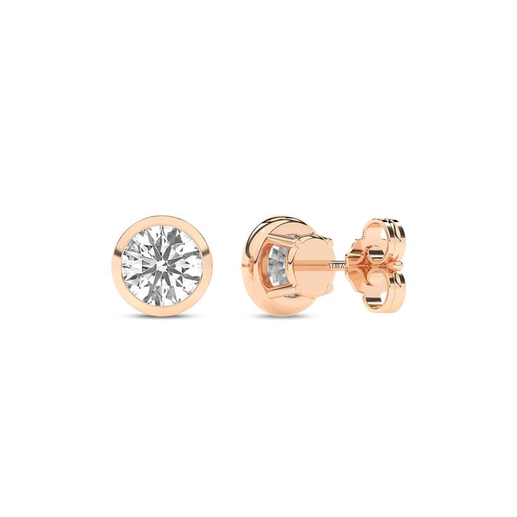 Immerse yourself in the understated beauty of our Round Solitaire Bezel Diamond Studs. Crafted with precision, each earring features a mesmerizing round diamond cradled in a sleek bezel setting. The minimalist design accentuates the lab-grown diamond's brilliance, making these diamond stud earrings a timeless addition to any jewelry collection. Anniversary Diamond Earrings With Tension Setting, Rose Gold Diamond Earrings With Single Diamond, Timeless Rose Gold Diamond Earrings, Formal Earrings With Tension Setting, Elegant Diamond Earrings With Tension Setting, 14k Gold Round Diamond Earrings Fine Jewelry, Fine Jewelry Round Diamond Earrings With Tension Setting, 14k Gold Round Diamond Earrings, Elegant Yellow Gold Diamond Earrings With Tension Setting