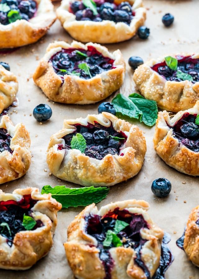 blueberry pies with fresh mint leaves on top