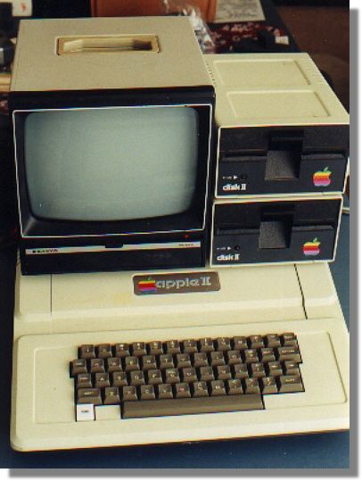 an old computer sitting on top of a table