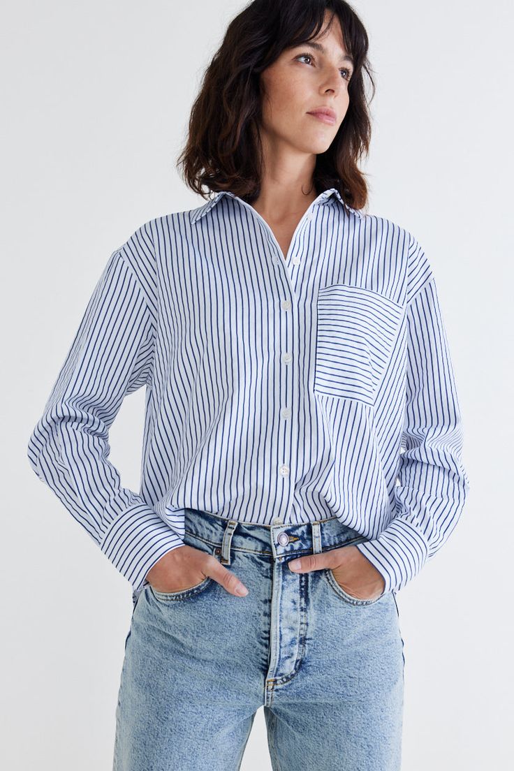 Elevate your fashion game with the pinnacle of poplin tops. Discover the unmatched quality, style, and comfort that our top-of-the-line poplin top offers. Pair it with tailored slacks or a skirt for a sophisticated office ensemble, or wear it with your favorite jeans for a chic, casual look. Two breast pockets Collared Button down Long sleeves Casual Long Sleeve Poplin Top, Relaxed Fit Poplin Top For Work, Casual Poplin Tops For Office, Navy Cotton Tops For Daywear, Relaxed Fit Poplin Button-up Top, Blue Poplin Tops For Workwear, Blue Poplin Tops For Work, Casual Poplin Blouse For Workwear, Spring Poplin Tops With Relaxed Fit