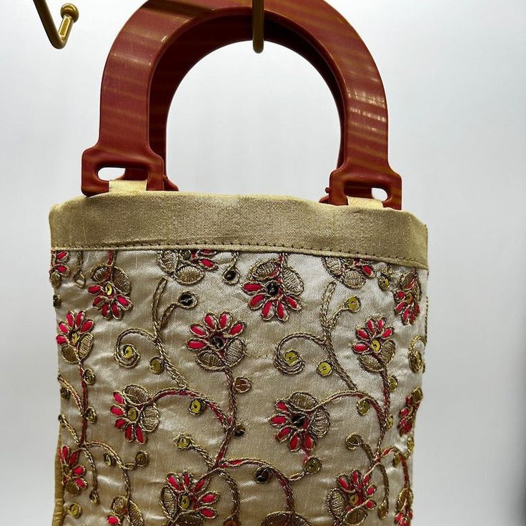 Purse bag handbag with beautiful embroidery circular pattern. Purse has enough space for 2 cell phones.A perfect party bag for an evening out, can we used for casual or formal.Silk material Embroidered Shoulder Bag For Party, Festive Evening Handheld Shoulder Bag, Festive Handheld Evening Shoulder Bag, Beige Embroidered Shoulder Bag For Evening, Elegant Fabric Shoulder Bag, Beige Embroidered Evening Shoulder Bag, Formal Embroidered Beige Potli Bag, Elegant Evening Shoulder Bag In Fabric, Elegant Beige Embroidered Shoulder Bag