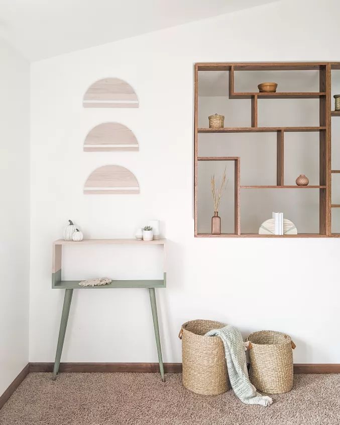 modern console table and wall decor in the living room with text overlay that reads modern console table & wall decor