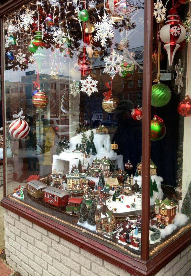 a store front with christmas decorations in the window