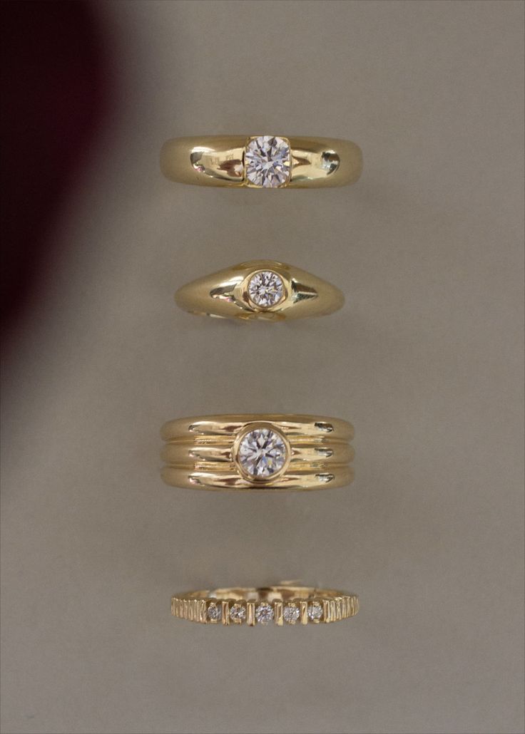 three different types of rings with diamonds on them