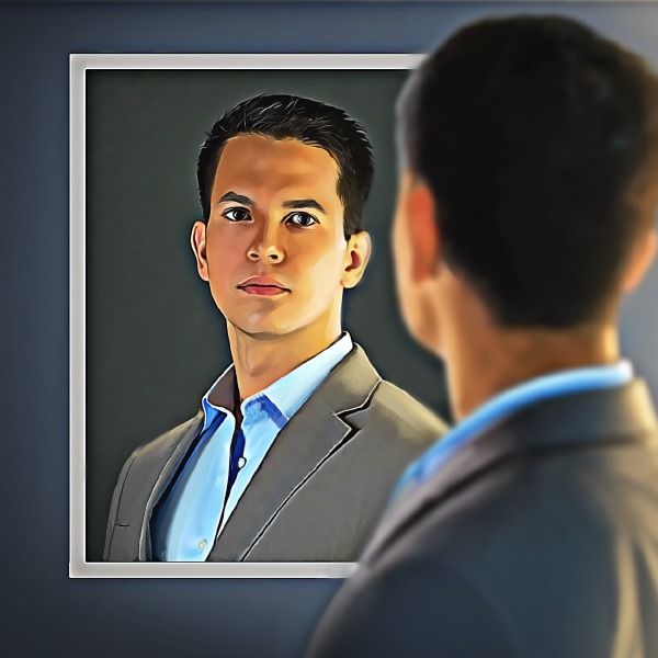 a man in a suit looking at himself in the mirror