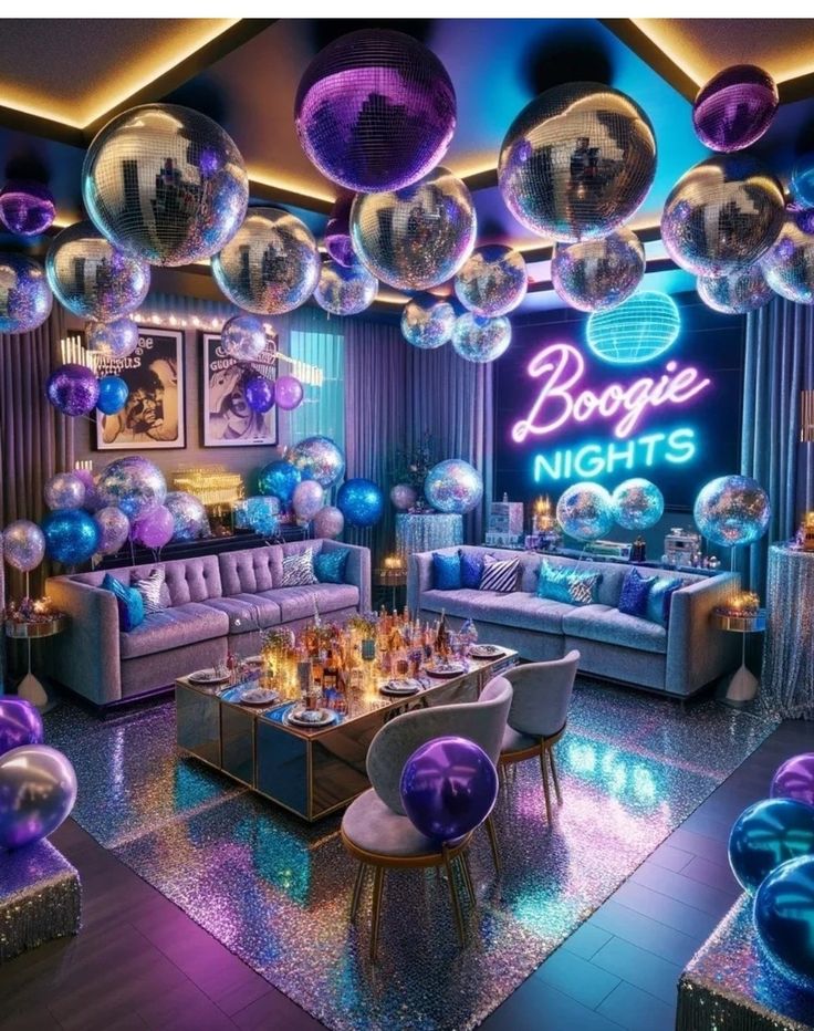 a room filled with lots of balloons and couches in front of a neon sign