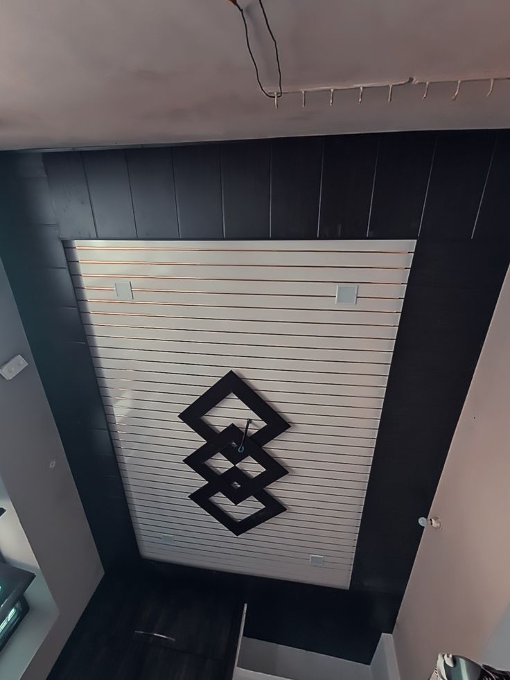 an overhead view of a garage door with a black and white design on the side