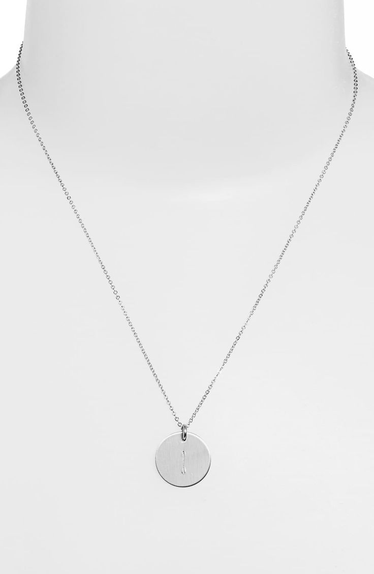 From humble beginnings to a fully staffed warehouse in Bend, Oregon, Nashelle remains true to its original purpose-handmade jewelry crafted with love and intention. A hand-stamped initial is centered on a gorgeous sterling silver disc attached to a chain-link necklace. Style Name:Nashelle Sterling Silver Initial Disc Necklace. Style Number: 813134. Minimalist Stamped Pendant Jewelry, Minimalist Stamped Sterling Silver Charm Necklaces, Minimalist Stamped Sterling Silver Charm Necklace, Silver Hand Stamped Round Pendant Jewelry, Silver Hand-stamped Round Pendant Jewelry, Dainty White Gold Jewelry With Engraving Option, Minimalist White Gold Jewelry With Engraving Option, Silver Everyday Jewelry With Initials, Silver Jewelry With Initials For Everyday