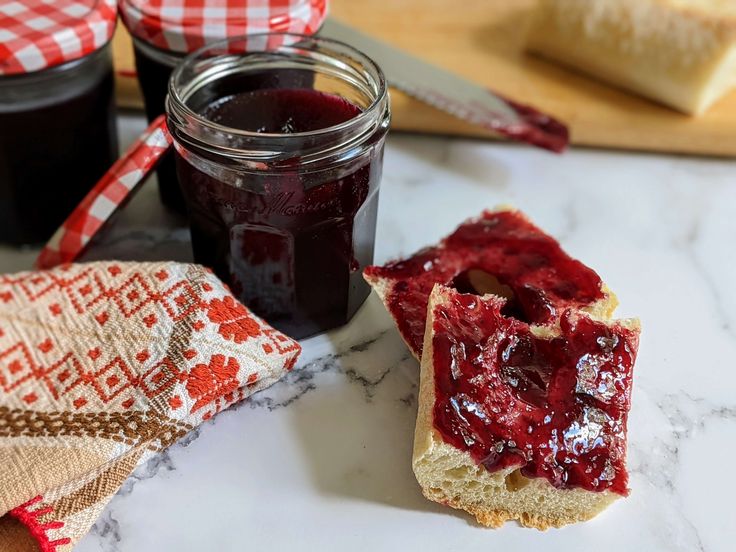 jam and bread on a marble counter top