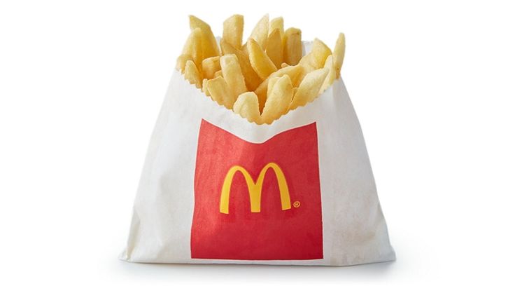 french fries in a paper bag on a white background