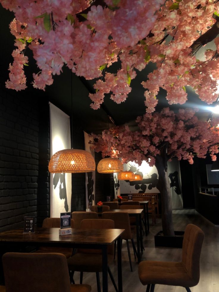 the dining room is decorated with cherry blossom trees