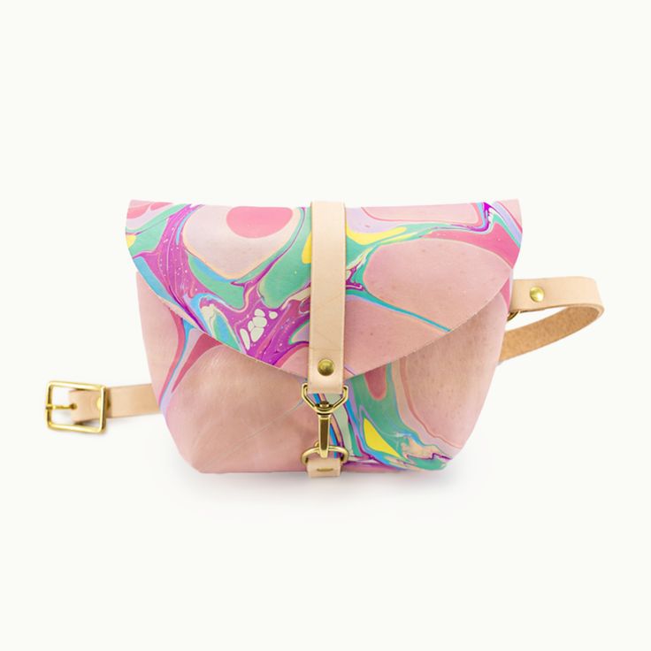 Marbled Colorful*Bag shown is Marbled Colorful with a natural strap. Our marbled items are one-of-a kind, the bag you will be receiving will not be this exact bag. This listing is for a colorful palette. Everyone's favorite little bag, now roomier. Our best selling bag is as versatile as they come -- wear it cross body, across your hips, at your natural waist, or throw it over your shoulder. Tuck it under your arm when you're on that crowded train or at that concert. Whatever your next adventure Colorful Crossbody Bag For Everyday, Colorful Everyday Crossbody Bag, Multicolor Pouch Satchel For On-the-go, Adjustable Crossbody Bag With Removable Pouch, Multicolor Rectangular Belt Bag With Removable Pouch, Multicolor Rectangular Belt Bag For Everyday Use, Colorful Crossbody Bag With Adjustable Strap, Pink Shoulder Belt Bag For Mobile Phones, Pink Satchel With Adjustable Strap For Everyday Use