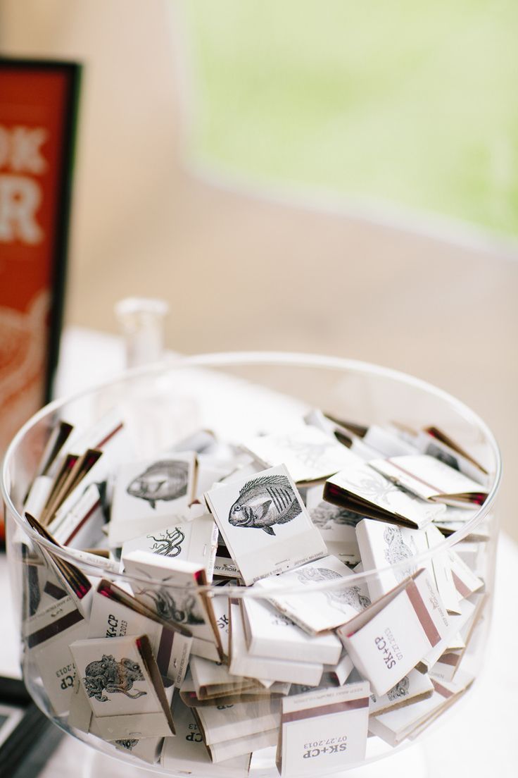 a glass bowl filled with lots of cards