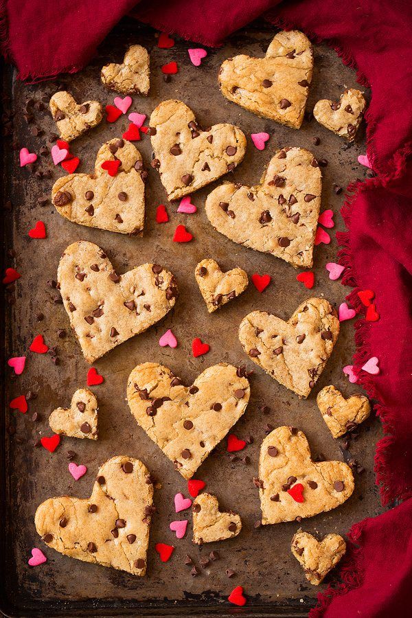 chocolate chip heart cookies on a baking sheet