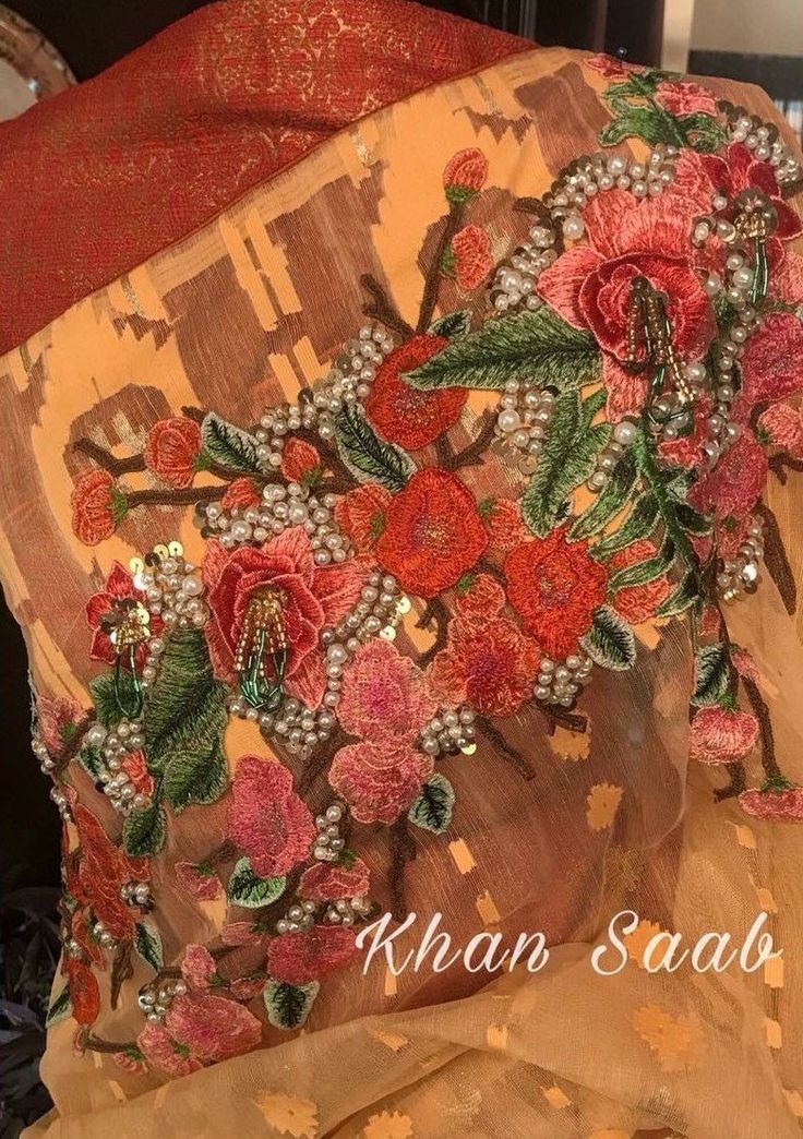 Khan Saab Designer Dhakai Jamdani Carnation Saree: Deshi Besh. Traditional Peach Pre-draped Saree With Zari Work, Traditional Pink Pre-draped Saree With Floral Embroidery, Traditional Peach Pre-draped Saree For Festive Occasions, Orange Pre-draped Saree With Dupatta For Festivals, Traditional Orange Georgette Pre-draped Saree, Orange Zari Work Pre-draped Designer Saree, Orange Zari Work Pre-draped Saree For Designer Wear, Designer Orange Pre-draped Saree With Zari Work, Orange Pre-draped Saree With Zari Work For Designer Wear