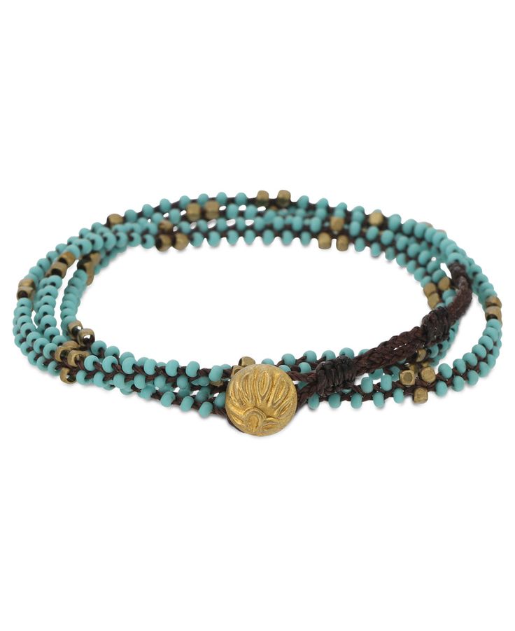 A single lotus-embossed brass bead serves as a closure for this multi-wrap bracelet. Made in conjunction with a project that supports women artisans struggling with poverty and HIV/AIDS. The lotus symbolizes perseverance in our own journey and reminds us that by adopting virtues such as compassion and patience, we enable ourselves to fully blossom. Wrap around bead bracelet Made of waxed cotton cord with brass and glass beads Color: Turquoise blue The end-to-end length is about 21.5" Wraps aroun Bead Wrap Bracelet, Multi Wrap Bracelet, Hiv Aids, Beaded Wrap Bracelets, Aids Hiv, Beaded Wraps, Color Turquoise, Women Artisans, Cotton Cord