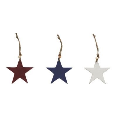 three wooden stars hanging from twine on string, one red white and one blue