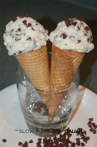 two ice cream cones with chocolate chips in them