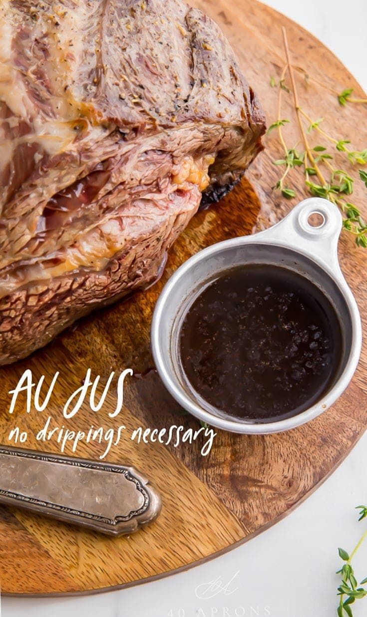 a large piece of meat sitting on top of a wooden cutting board